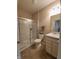 Bathroom featuring a glass-enclosed shower and a vanity with a sink and storage at 4960 Silverbell Dr, Plainfield, IN 46168