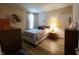Cozy bedroom with a floral-patterned bed, light-colored walls, and neutral-toned decor at 4960 Silverbell Dr, Plainfield, IN 46168
