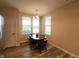 Cozy dining area featuring a classic table set, large windows, and neutral wall colors at 4960 Silverbell Dr, Plainfield, IN 46168