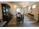 Bright dining area featuring modern flooring, a classic china cabinet, and stylish furnishings at 4960 Silverbell Dr, Plainfield, IN 46168