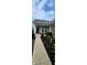Inviting front porch with brick accents, lush landscaping, and a well-lit walkway leading to the entrance at 4960 Silverbell Dr, Plainfield, IN 46168