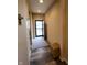 Entry hallway with a convenient bench seat, and access to other rooms at 4960 Silverbell Dr, Plainfield, IN 46168