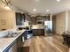 Open-concept kitchen with stainless steel appliances and a breakfast bar at 4960 Silverbell Dr, Plainfield, IN 46168
