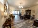Spacious open-concept living room with dining area, hardwood floors, and ample natural light at 4960 Silverbell Dr, Plainfield, IN 46168