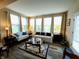 Inviting living room with large windows, wood floors, stylish sofas, and elegant decor at 4960 Silverbell Dr, Plainfield, IN 46168