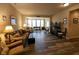 Comfortable living room featuring neutral colors, hardwood floors, and a cozy seating arrangement at 4960 Silverbell Dr, Plainfield, IN 46168
