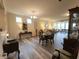 Open-concept living and dining area with modern flooring, a dining table, and stylish decor at 4960 Silverbell Dr, Plainfield, IN 46168