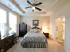 Comfortable primary bedroom with ceiling fan, neutral carpet, ceiling fan and large windows at 4960 Silverbell Dr, Plainfield, IN 46168