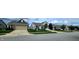 A street view displaying homes with well-manicured lawns and inviting curb appeal at 4960 Silverbell Dr, Plainfield, IN 46168