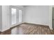Bright room leading out to the balcony with double doors and wood floors at 5097 Vantage Point Rd # B 2, Avon, IN 46123