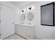 Bathroom with a double sink vanity with modern lighting and fixtures at 5097 Vantage Point Rd # B 2, Avon, IN 46123