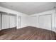 Bedroom with wood floors, white trim, and closet at 5097 Vantage Point Rd # B 2, Avon, IN 46123