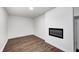 Bedroom features wood floors and modern fireplace at 5097 Vantage Point Rd # B 2, Avon, IN 46123