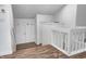 Bright foyer with wood floors, white walls and banister, and double doors at 5097 Vantage Point Rd # B 2, Avon, IN 46123