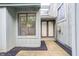 Inviting entrance with double doors, window, and black mulch landscaping at 5097 Vantage Point Rd # B 2, Avon, IN 46123