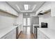 Bright kitchen with stainless steel appliances, white cabinetry, and wood-look flooring at 5097 Vantage Point Rd # B 2, Avon, IN 46123