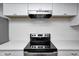 Modern kitchen with sleek black cooktop, white countertops and cabinets at 5097 Vantage Point Rd # B 2, Avon, IN 46123