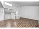 Spacious living room with wood floors, high ceilings, and access to the foyer at 5097 Vantage Point Rd # B 2, Avon, IN 46123