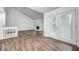 Bright living room with fireplace, vaulted ceilings, balcony access, and wood flooring at 5097 Vantage Point Rd # B 2, Avon, IN 46123