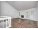 Spacious living room with vaulted ceiling, fireplace, and wood floors at 5097 Vantage Point Rd # B 2, Avon, IN 46123