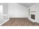 Living room featuring a cozy fireplace, vaulted ceilings, and wood flooring at 5097 Vantage Point Rd # B 2, Avon, IN 46123