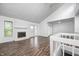 Bright living room with fireplace, vaulted ceilings, and access to a balcony at 5097 Vantage Point Rd # B 2, Avon, IN 46123
