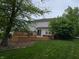 Expansive wooden deck ideal for outdoor entertainment, complemented by a spacious backyard and mature trees at 5305 Potomac Ln, Greenwood, IN 46142