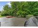 Home exterior features deck with hot tub and grill, surrounded by lush greenery at 5640 High Vista Cir, Indianapolis, IN 46234