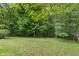 Backyard features mature trees offering natural privacy and serenity at 5640 High Vista Cir, Indianapolis, IN 46234