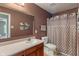 Bathroom features a large mirror, updated vanity, and shower with curtain at 5640 High Vista Cir, Indianapolis, IN 46234
