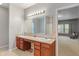 Large bathroom features a double vanity with an extra-large mirror and access to the bedroom at 5640 High Vista Cir, Indianapolis, IN 46234