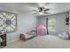 Bright bedroom featuring playful decor, a cozy bed, and a reading nook at 5640 High Vista Cir, Indianapolis, IN 46234