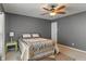 Comfortable bedroom with natural light, ceiling fan, and cozy decor at 5640 High Vista Cir, Indianapolis, IN 46234