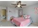 bedroom features ceiling fan, plush toys, and pink bedding at 5640 High Vista Cir, Indianapolis, IN 46234