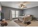 Cozy bedroom with a ceiling fan, plush rug, and comfortable furnishings at 5640 High Vista Cir, Indianapolis, IN 46234