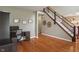 Inviting entryway with hardwood floors, a staircase with rod iron spindles, and decorative wall art at 5640 High Vista Cir, Indianapolis, IN 46234
