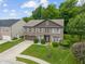 Beautiful two-story brick home features a two-car garage and nicely landscaped front yard at 5640 High Vista Cir, Indianapolis, IN 46234