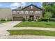 Traditional two-story brick home with a well-maintained lawn and attached two car garage at 5640 High Vista Cir, Indianapolis, IN 46234