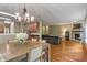 Open concept living area featuring a fireplace, open kitchen and hardwood floors at 5640 High Vista Cir, Indianapolis, IN 46234