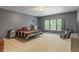Spacious main bedroom boasts a calming color palette, carpet flooring, and large windows at 5640 High Vista Cir, Indianapolis, IN 46234