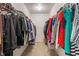 Spacious walk-in closet features ample storage with metal racks and shelving for organized living at 5640 High Vista Cir, Indianapolis, IN 46234