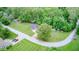 An aerial view of a charming single Gathering home featuring a well-manicured lawn and mature trees at 5739 Paradise Dr, Martinsville, IN 46151
