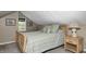 Attic bedroom with carpeted floors, a window, and a bed with striped bedding at 5739 Paradise Dr, Martinsville, IN 46151