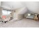 Converted attic space into a bedroom featuring neutral carpet, ceiling fan, and a large window at 5739 Paradise Dr, Martinsville, IN 46151