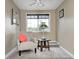 Finished attic room with neutral carpet, a seating area, and large window at 5739 Paradise Dr, Martinsville, IN 46151
