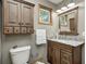 Well-lit bathroom with granite countertop, framed mirror, and ample storage at 5739 Paradise Dr, Martinsville, IN 46151