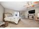 Bright bedroom featuring a ceiling fan, french doors, carpet, and antique furnishings at 5739 Paradise Dr, Martinsville, IN 46151