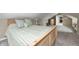Cozy bedroom featuring striped bedding and an open doorway at 5739 Paradise Dr, Martinsville, IN 46151