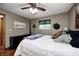 Inviting bedroom featuring a picture window, a ceiling fan, and plush throw at 5739 Paradise Dr, Martinsville, IN 46151