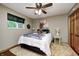 Comfortable bedroom with ceiling fan, plush carpeting, and warm decor at 5739 Paradise Dr, Martinsville, IN 46151